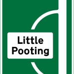 Junction ahead of a primary route with non-primary route through a town or village that has been by-passed
