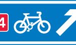 Direction of a numbered route for pedal cycles forming part of a national cycle network at a junction