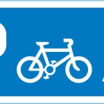 Junction ahead leading to a parking place for pedal cycles