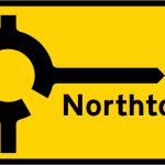 Roundabout ahead leading to a temporary diversion route to the destination shown