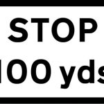 100 yards to a junction ahead controlled by a STOP sign