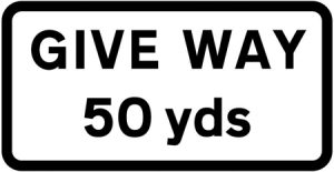 50 yards to junction ahead controlled by a GIVE WAY sign