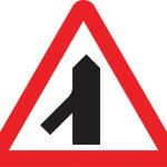 Traffic merges ahead from the left