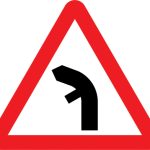 Junction on left bend ahead