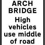 High vehicles to use middle of road at arch bridge ahead