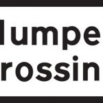 Crossing on road hump ahead