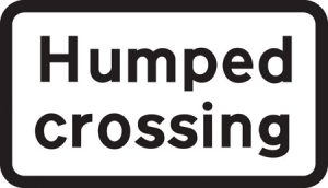Crossing on road hump ahead