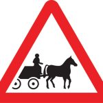 Horse drawn vehicles likely to be in road ahead