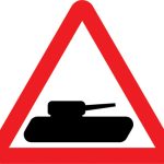 Slow moving military vehicles likely to be crossing or in the road