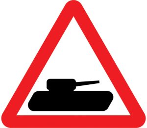 Slow moving military vehicles likely to be crossing or in the road