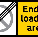 End of designated off-highway loading area in which waiting restriction apply