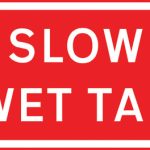Vehicular traffic should proceed slowly owing to temporary hazard resulting from wet tar on the road