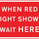 Vehicles may not pass the temporary traffic signals when the red light is shown