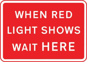 Vehicles may not pass the temporary traffic signals when the red light is shown