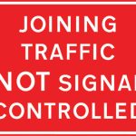 Traffic joining a length of road being controlled by portable traffic signals is not controlled by these signals