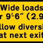 Instructions to drivers of wide loads to follow a diversion to avoid the road works ahead