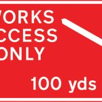 Direction to be taken by road works or construction traffic to an access to a works site 100 yards ahead