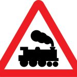 Railway level crossing without gate or barrier ahead