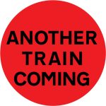 Another train or tramcar may be about to pass over the level crossing