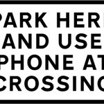 Place where drivers of large or slow, or long low vehicles should park near a level crossing while contacting the signal operator
