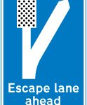 Escape lane ahead for vehicles unable to stop on a steep hill