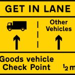 Goods vehicles should get into the left lane to attend a goods vehicle check point ahead