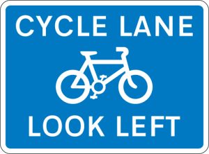 Cycle lane with traffic proceeding from left (pedestrian reminder)